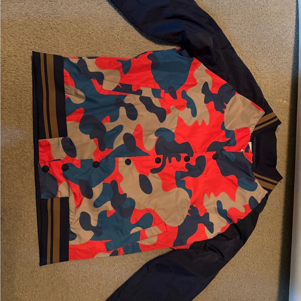 Camouflage Jacket with Red and Blue Accents
